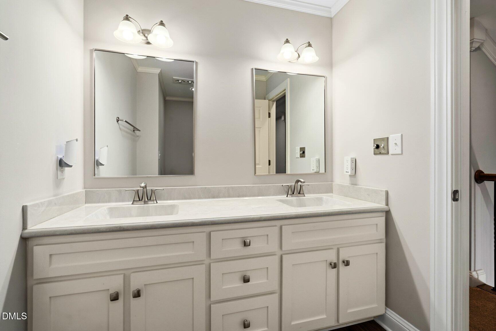 726 Thomas Road Rocky Mount, NC 27801 - Photo 21 of 55 a bathroom with double sink and a mirror