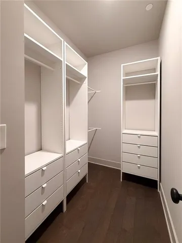 a room with white furniture and window