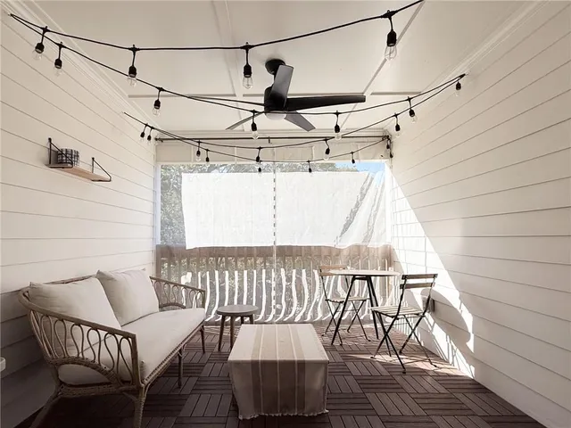 a view of a balcony with furniture