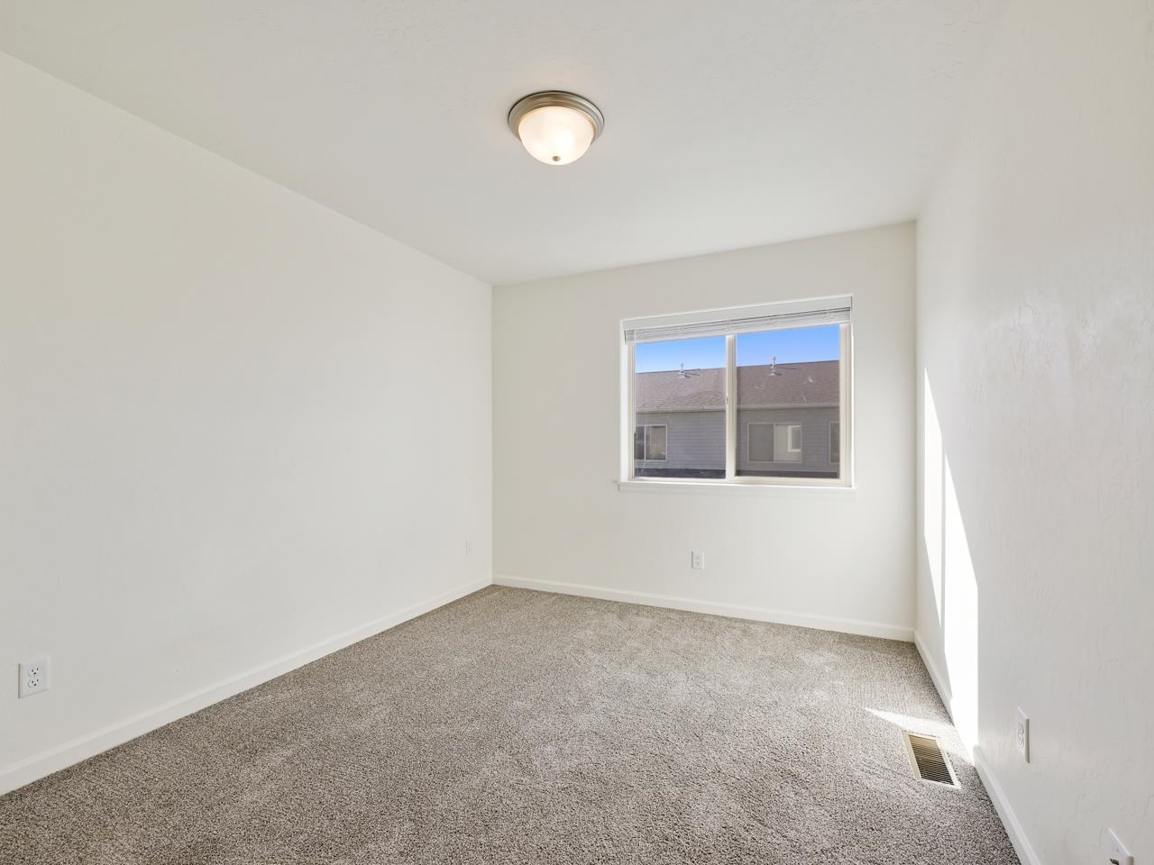 655 Trinity Way, Unit C Grand Junction, CO 81505 - Photo 12 of 20 an empty room with a window