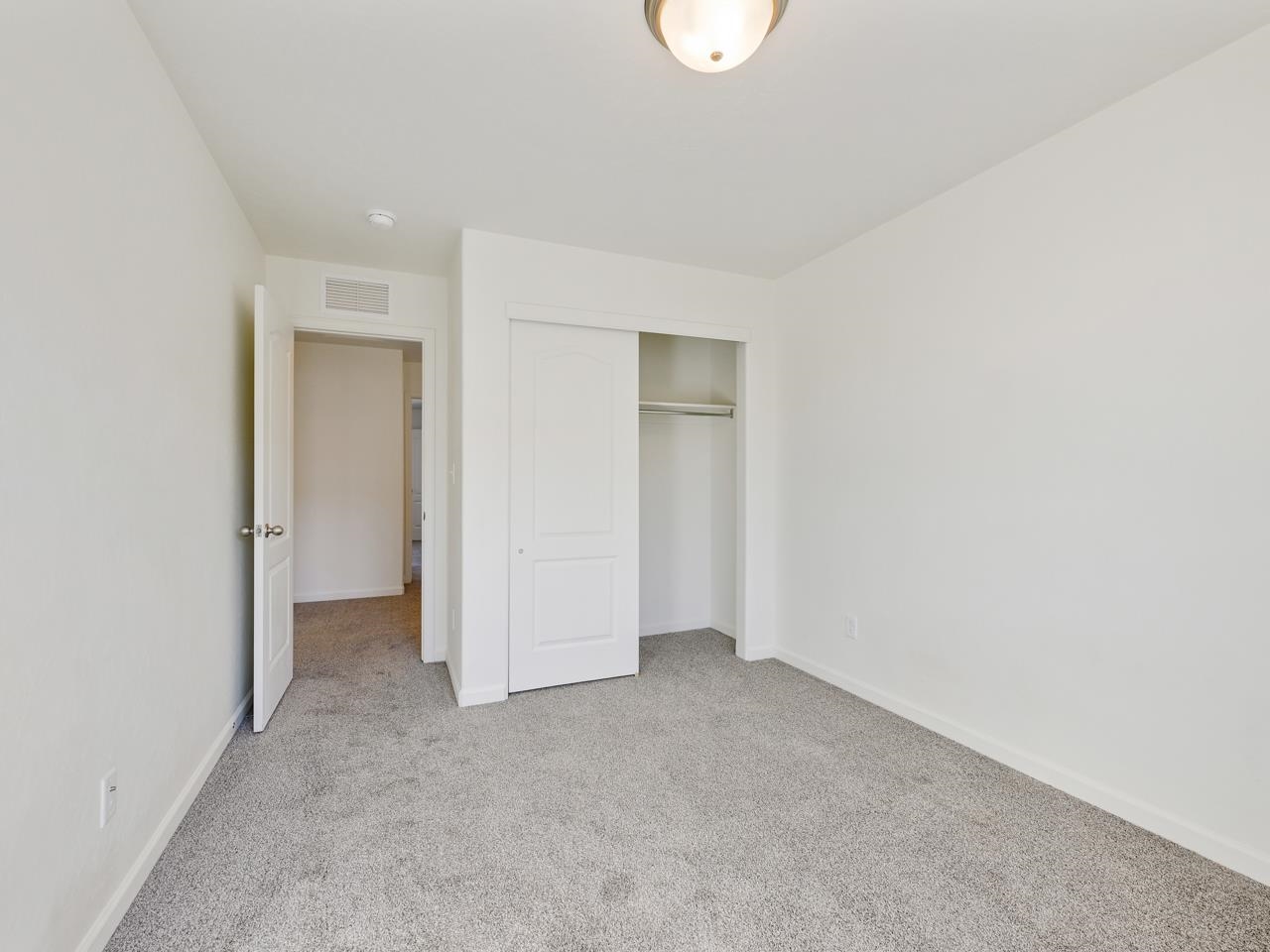 655 Trinity Way, Unit C Grand Junction, CO 81505 - Photo 13 of 20 a view of an empty room and a window