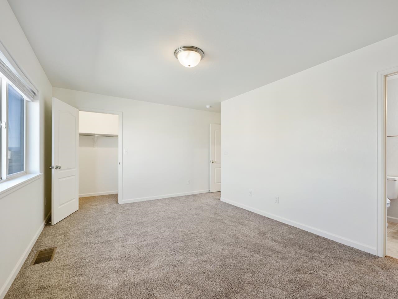655 Trinity Way, Unit C Grand Junction, CO 81505 - Photo 10 of 20 an empty room with a natural light