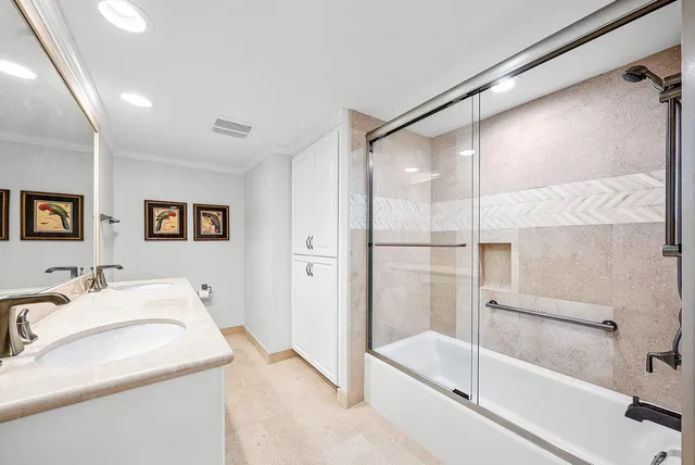 a view of a bedroom with a couch and table chair