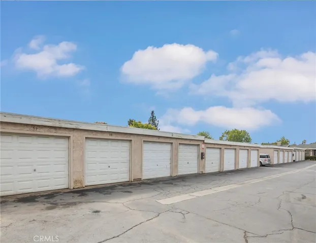 a view of a white house with a large window