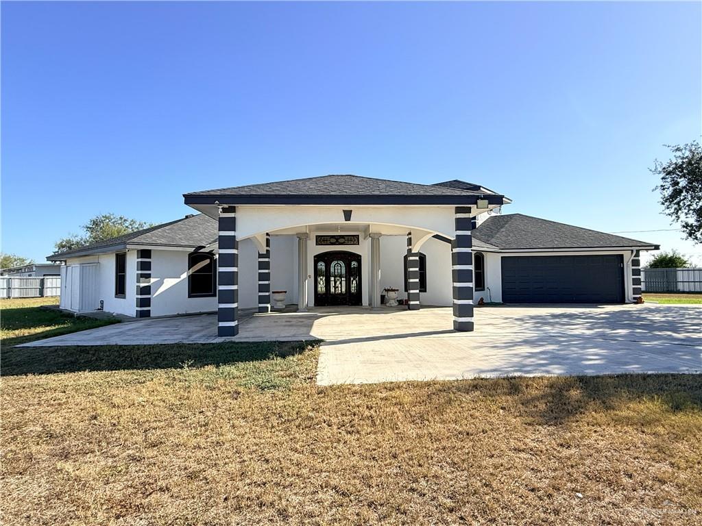10766 North Minnesota Road Mission, TX 78574 - Photo 2 of 39 a view of a house with a yard and plants