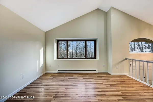 a view of kitchen with furniture and wooden floor