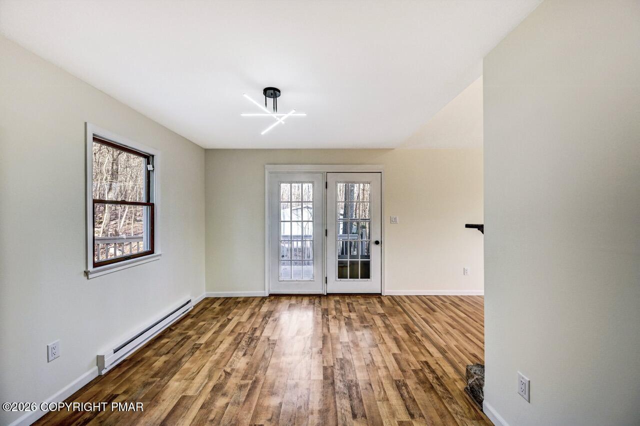 171 Foothill Boulevard Effort, PA 18330 - Photo 16 of 61 an empty room with wooden floor and windows