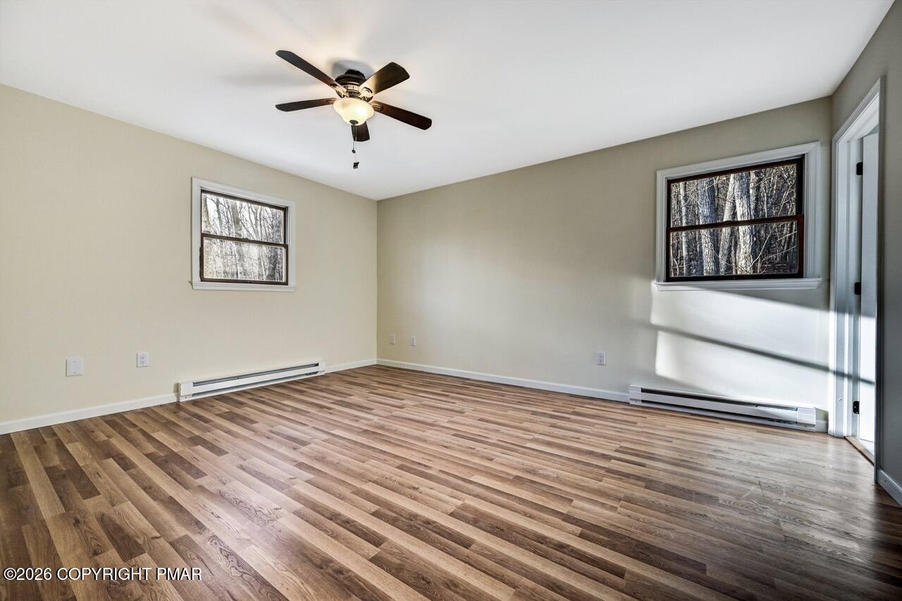 171 Foothill Boulevard Effort, PA 18330 - Photo 26 of 61 a view of an empty room with a window and wooden floor