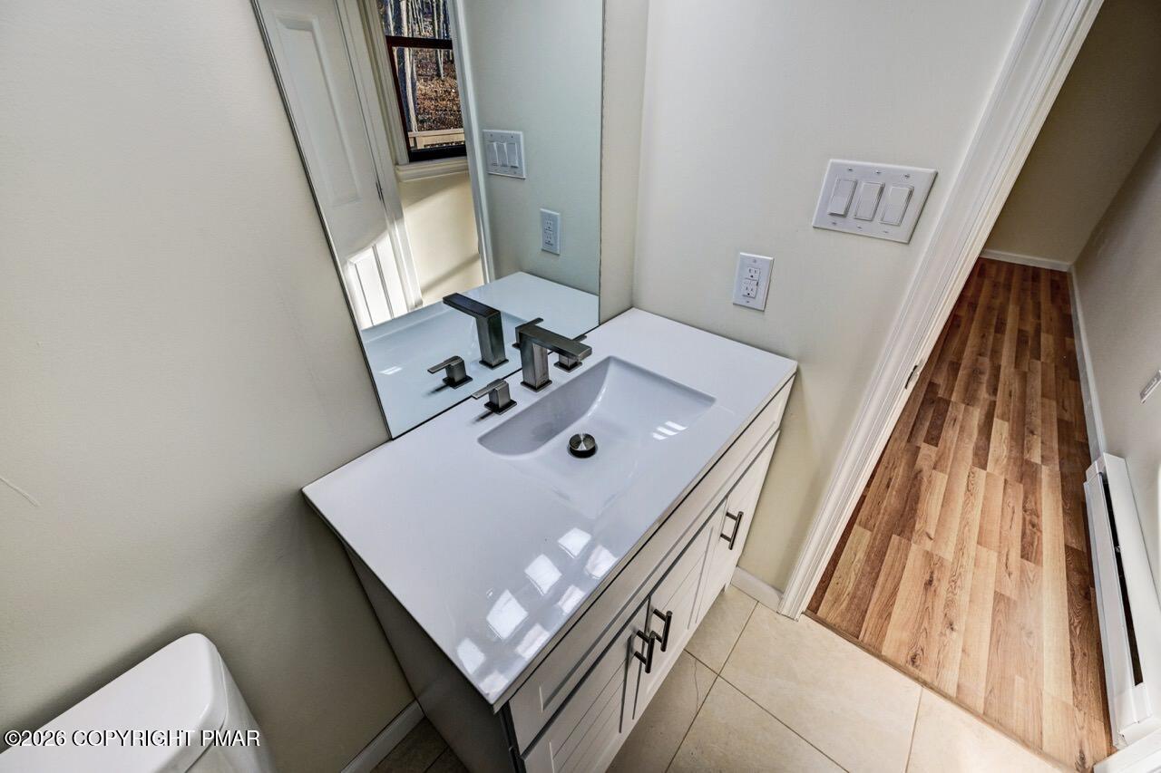 171 Foothill Boulevard Effort, PA 18330 - Photo 31 of 61 a bathroom with a sink a mirror and vanity