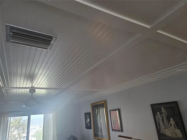 a view of a hallway with windows