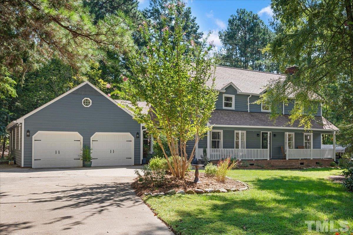 5116 Hallmark Road Durham, NC 27712 - Photo 1 of 31 a view of a house with backyard and trees