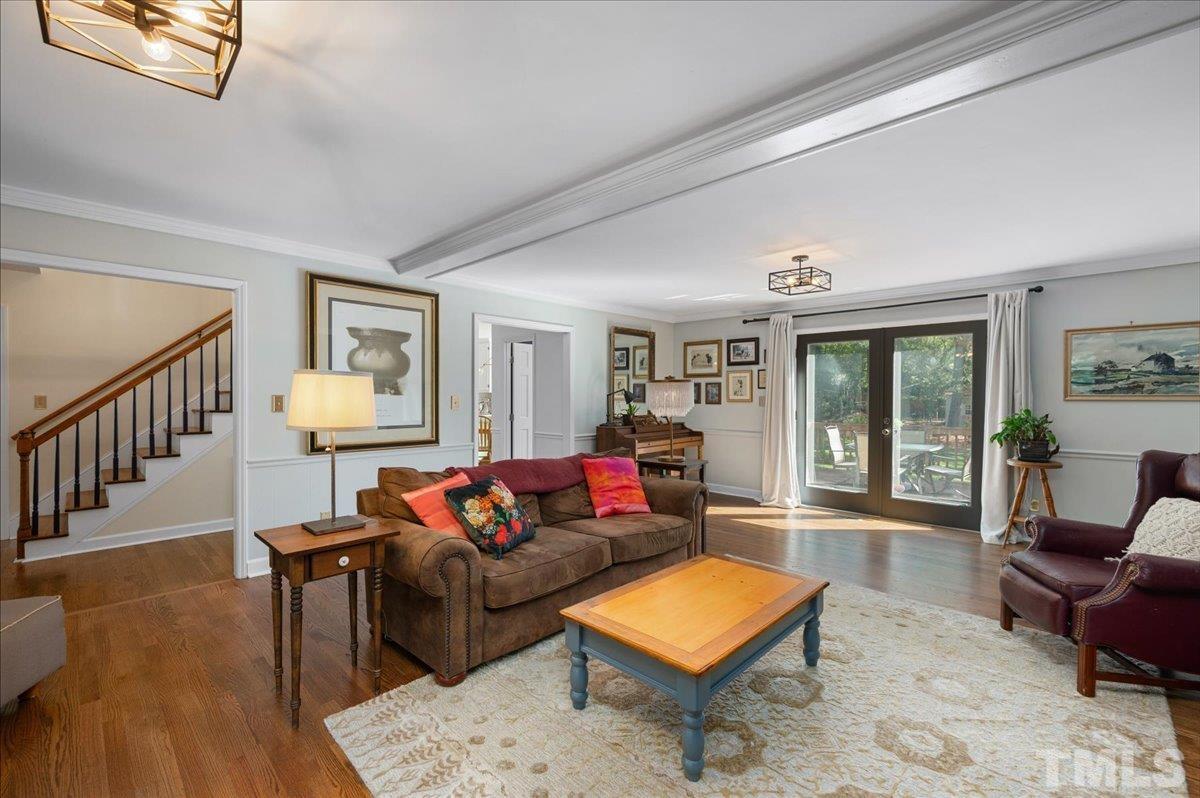 5116 Hallmark Road Durham, NC 27712 - Photo 11 of 31 a living room with furniture and a wooden floor