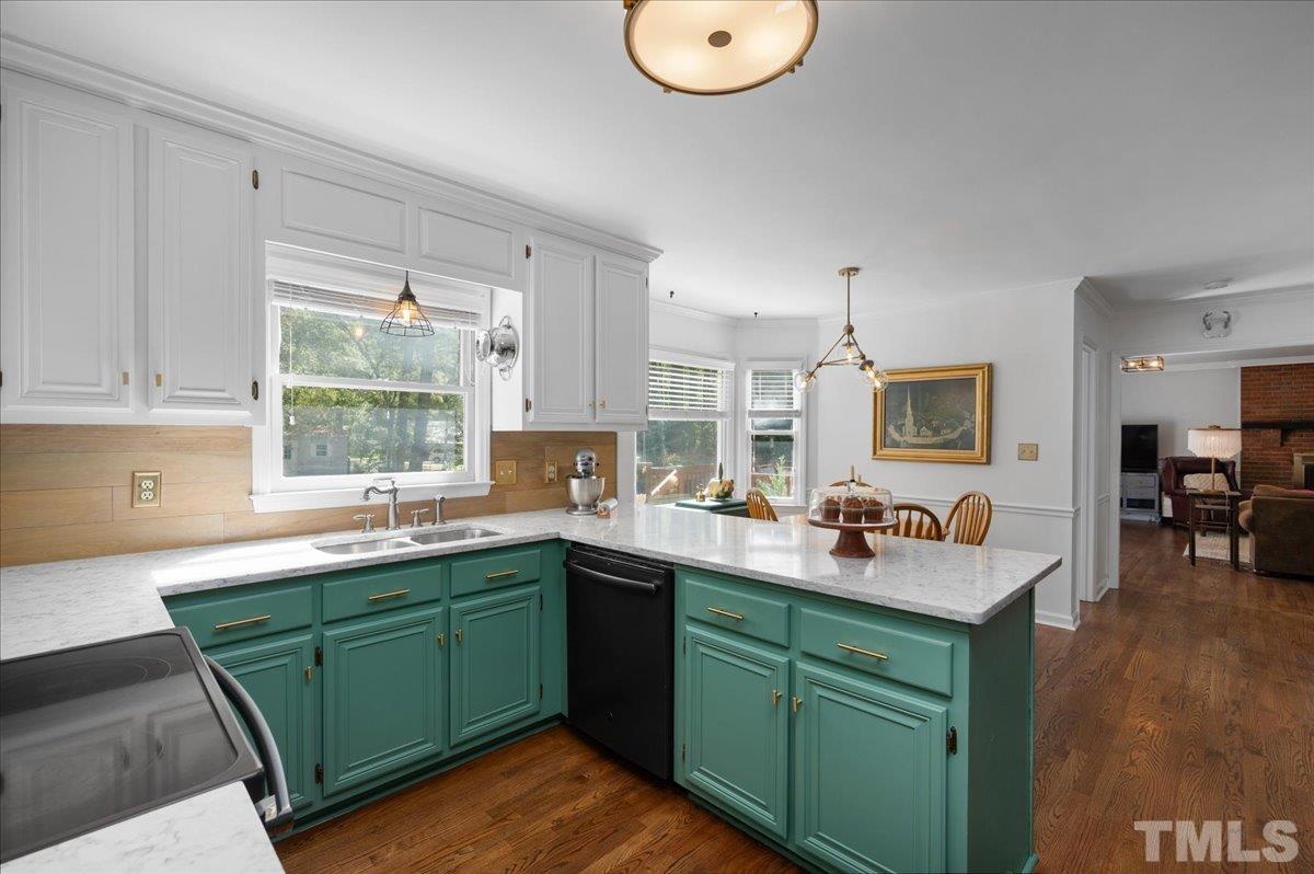 5116 Hallmark Road Durham, NC 27712 - Photo 18 of 31 a kitchen with a sink cabinets and window
