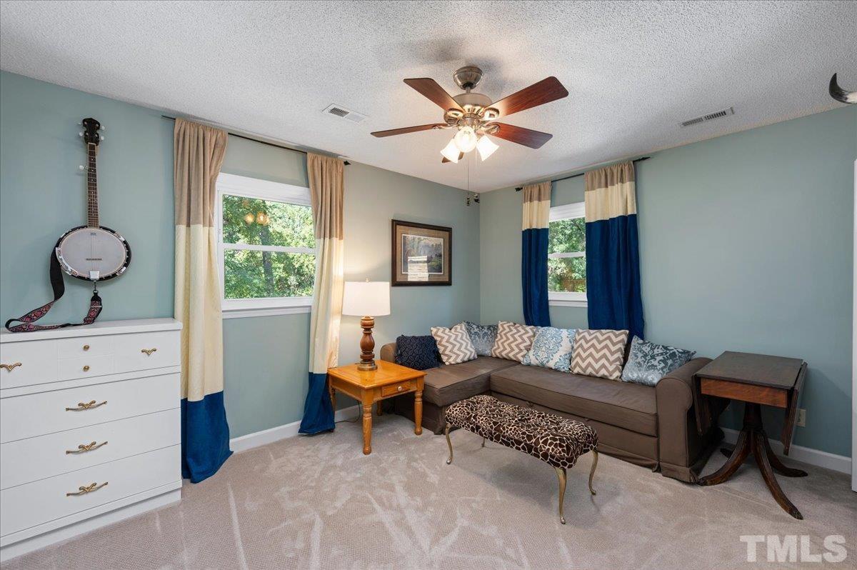 5116 Hallmark Road Durham, NC 27712 - Photo 24 of 31 a living room with furniture and a window