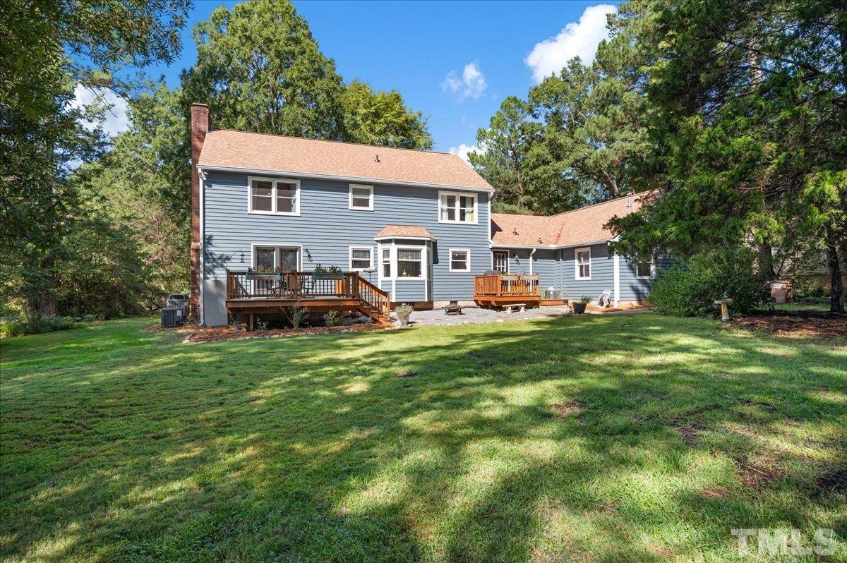 5116 Hallmark Road Durham, NC 27712 - Photo 27 of 31 a view of a house with a backyard