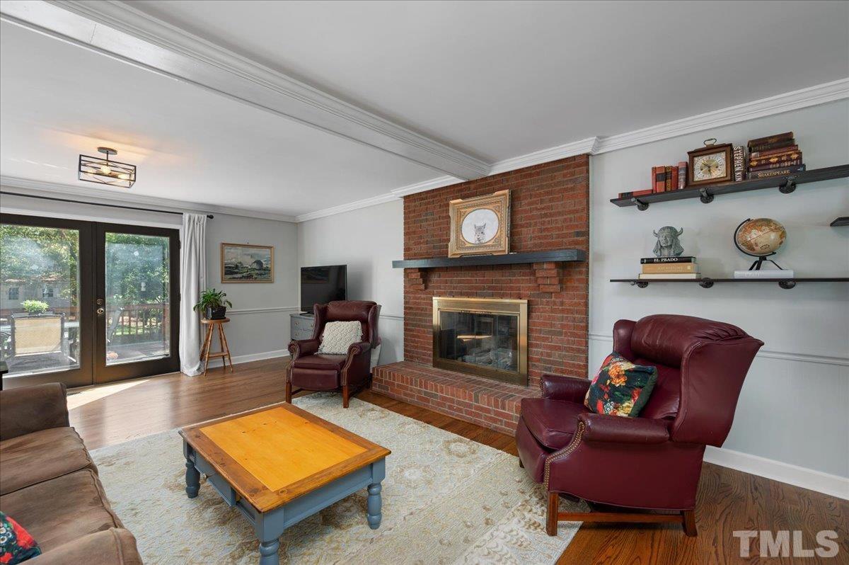 5116 Hallmark Road Durham, NC 27712 - Photo 4 of 31 a living room with furniture and a fireplace
