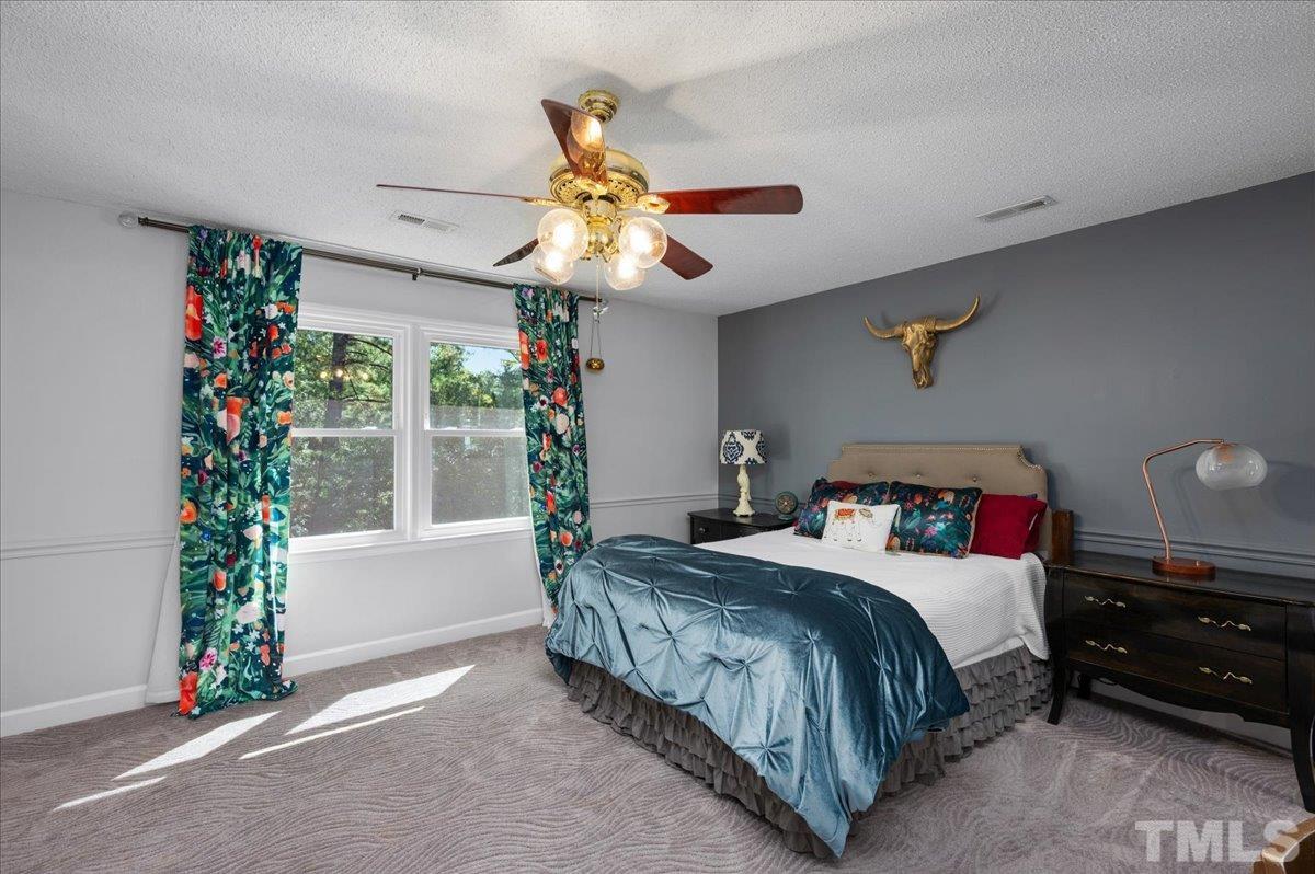 5116 Hallmark Road Durham, NC 27712 - Photo 6 of 31 a bedroom with a bed and a window