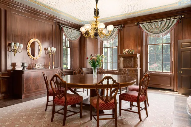 a dining room with furniture and window