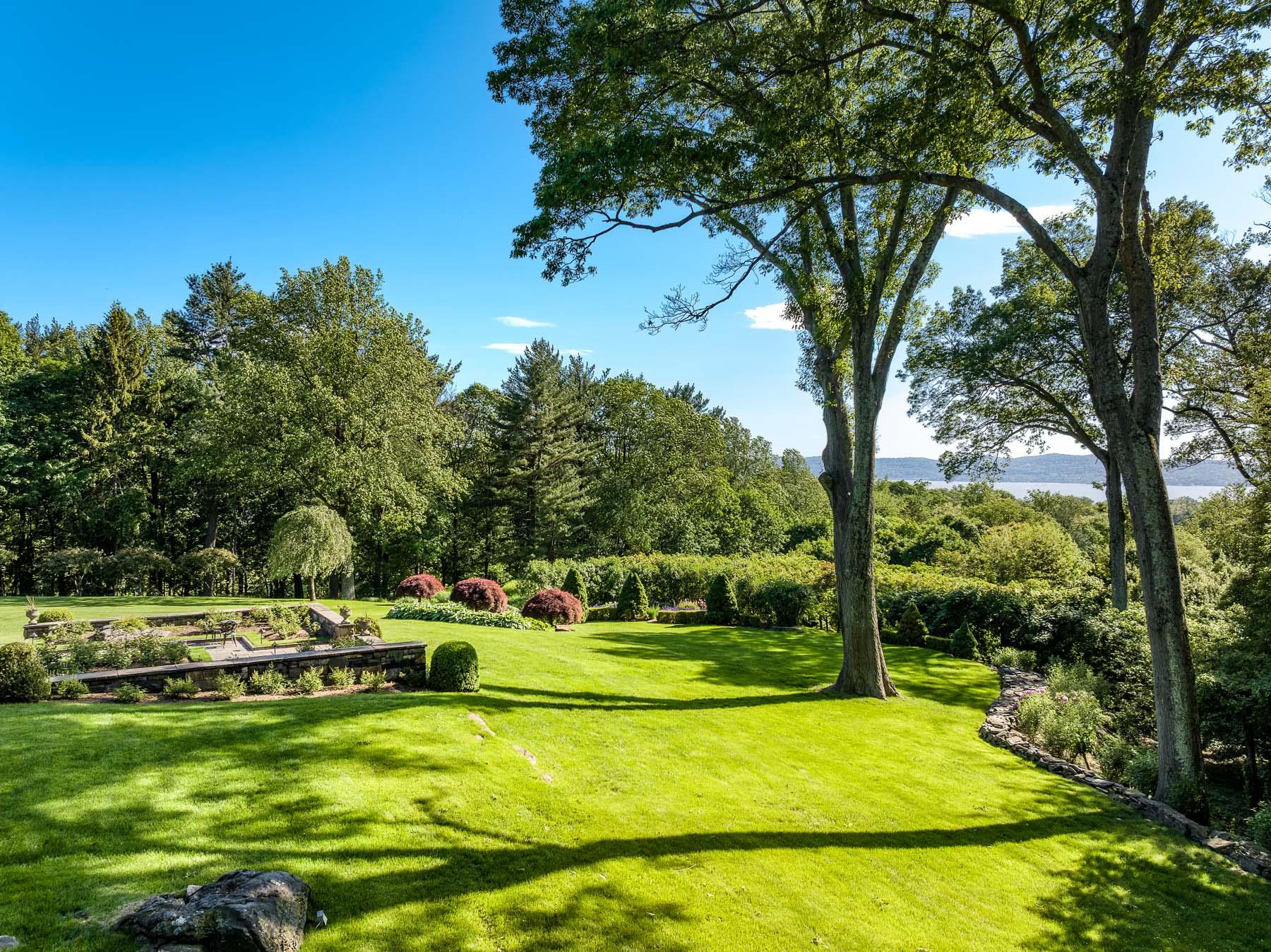 842 Sleepy Hollow Road Briarcliff Manor, NY 10510 - Photo 18 of 35 a view of a swimming pool with a garden