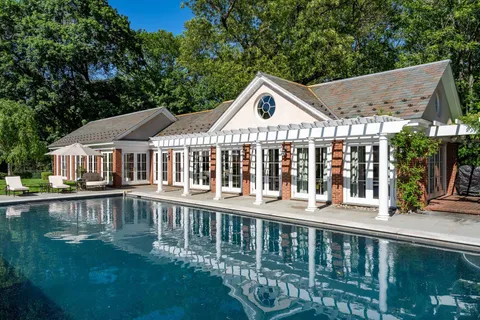 a front view of a house with swimming pool