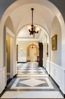 a view of a hallway with a chandelier