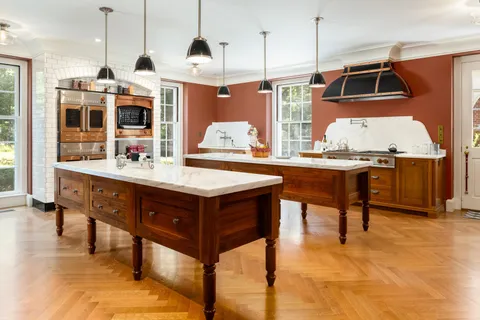 a kitchen with a table chairs and a couch