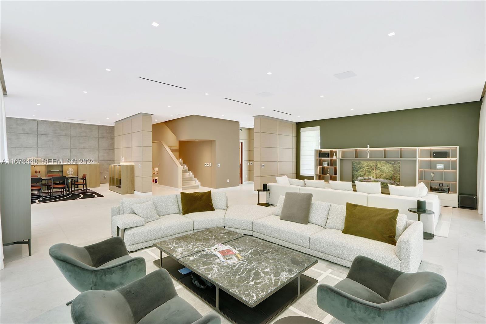 9860 Northeast 5th Avenue Road Miami Shores, FL 33138 - Photo 15 of 56 a living room with furniture and a large window
