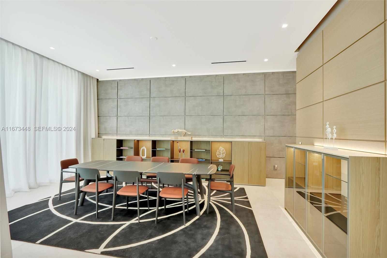 9860 Northeast 5th Avenue Road Miami Shores, FL 33138 - Photo 21 of 56 a dinning table and chairs in a room