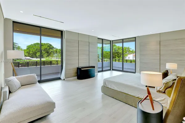 a white bath tub sitting in a spacious bathroom