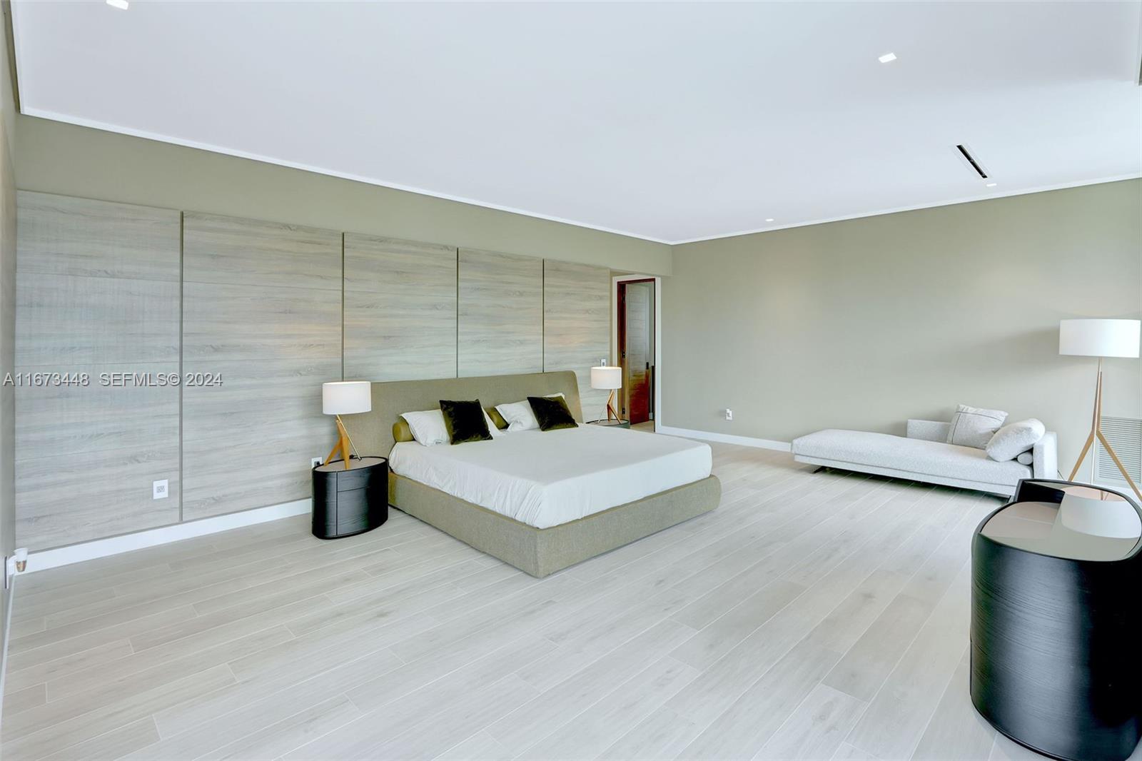 9860 Northeast 5th Avenue Road Miami Shores, FL 33138 - Photo 34 of 56 a living room with furniture and a table