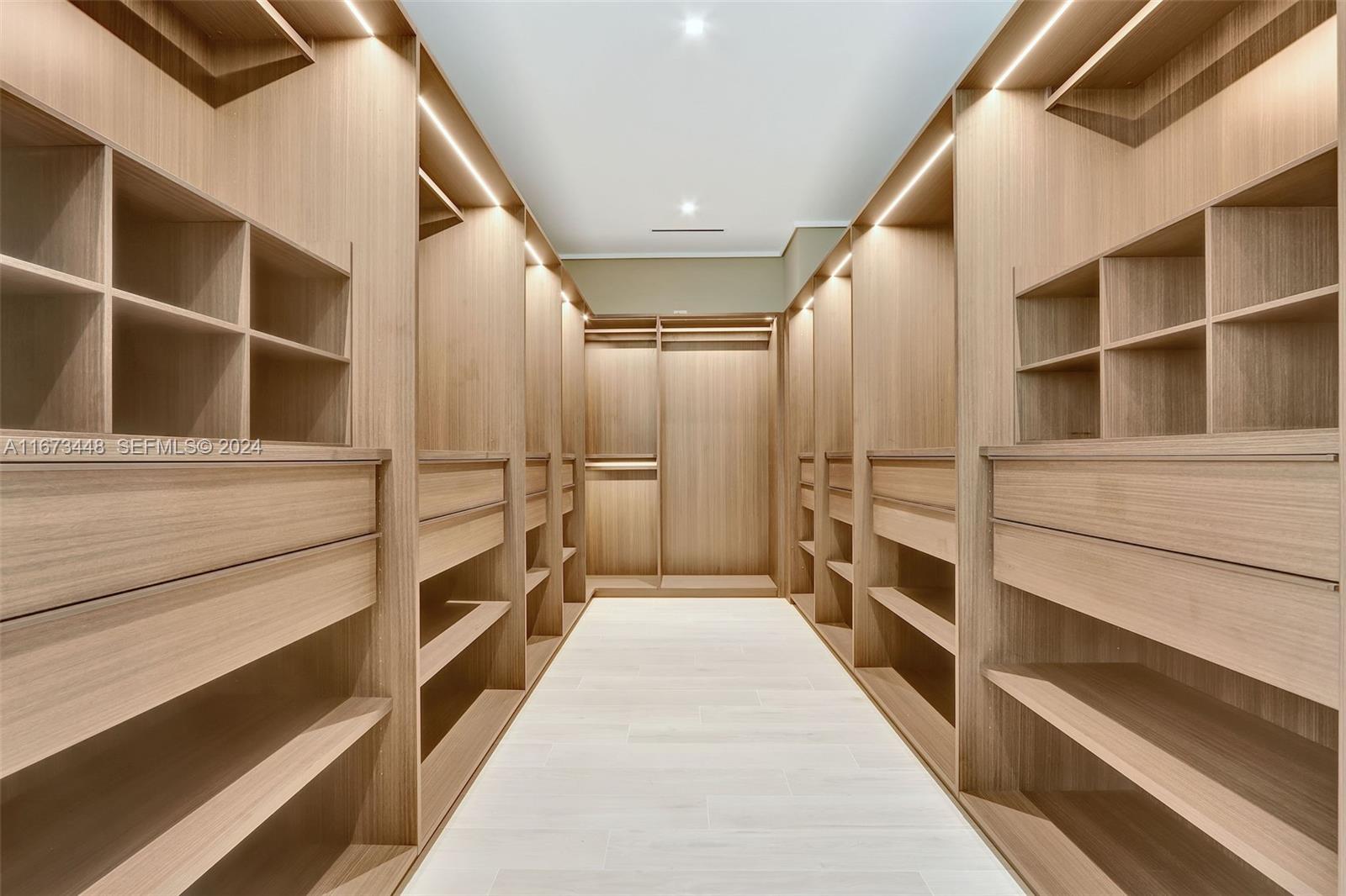 9860 Northeast 5th Avenue Road Miami Shores, FL 33138 - Photo 35 of 56 a view of walk in closet with empty racks
