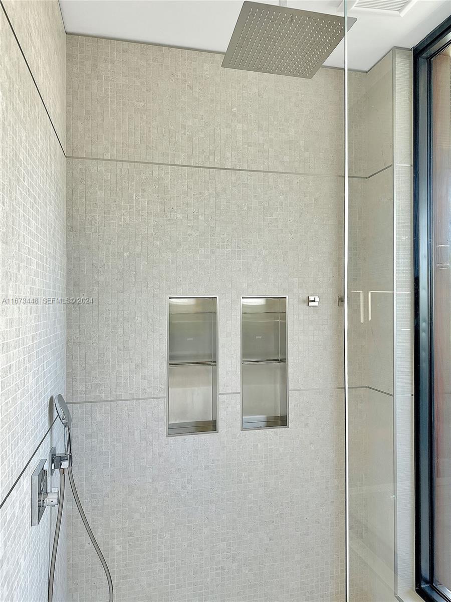 9860 Northeast 5th Avenue Road Miami Shores, FL 33138 - Photo 38 of 56 a bathroom with a shower