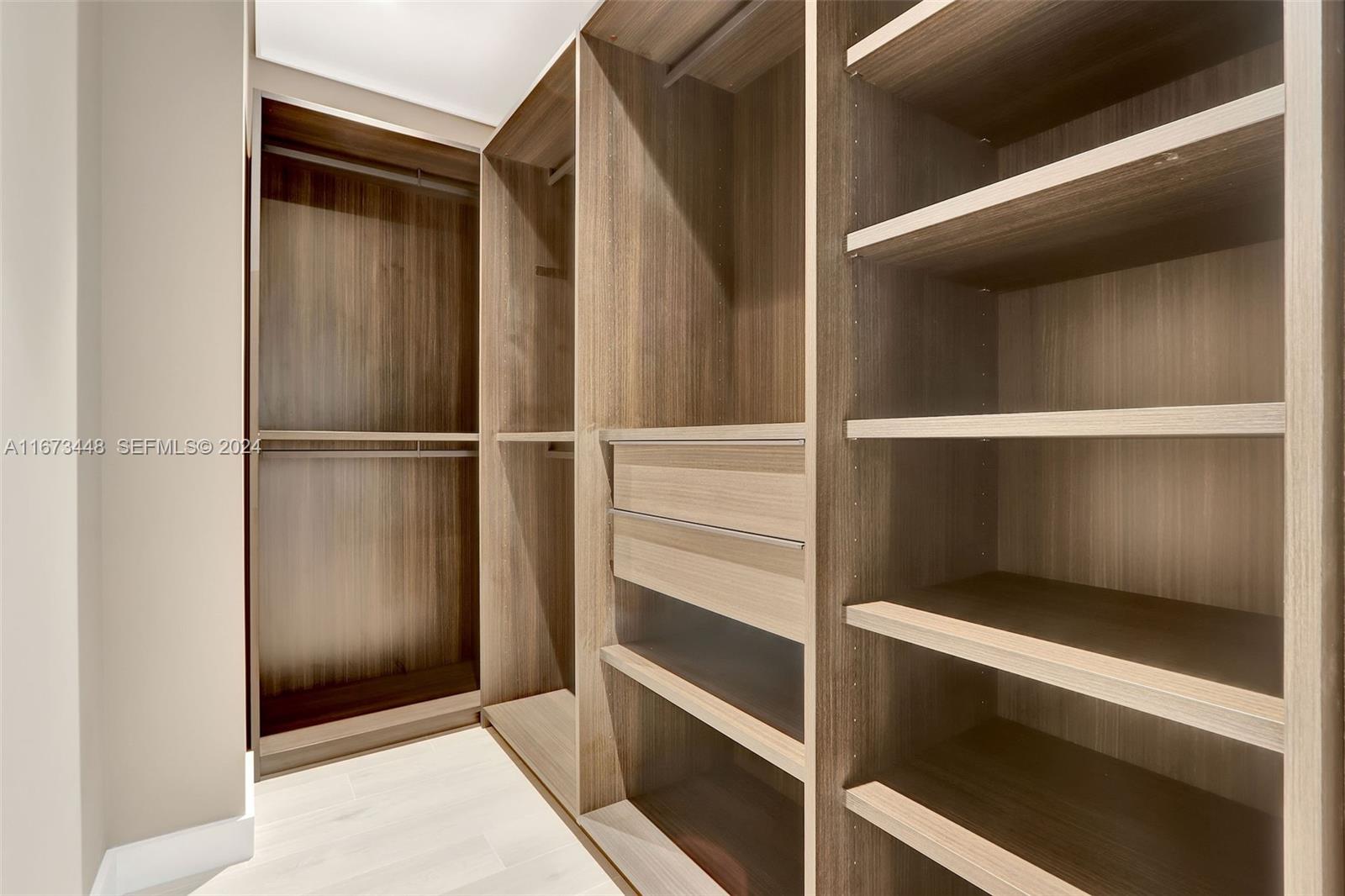 9860 Northeast 5th Avenue Road Miami Shores, FL 33138 - Photo 40 of 56 a view of an empty walk in closet