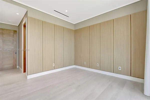 a view of an empty room with sliding door