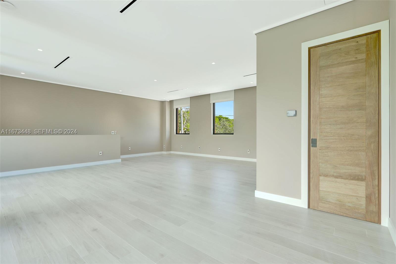 9860 Northeast 5th Avenue Road Miami Shores, FL 33138 - Photo 53 of 56 an empty room with windows and closet