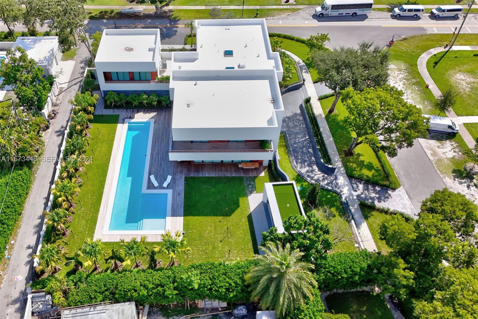 9860 Northeast 5th Avenue Road Miami Shores, FL 33138 - Photo 8 of 56 an aerial view of a house with a garden and swimming pool
