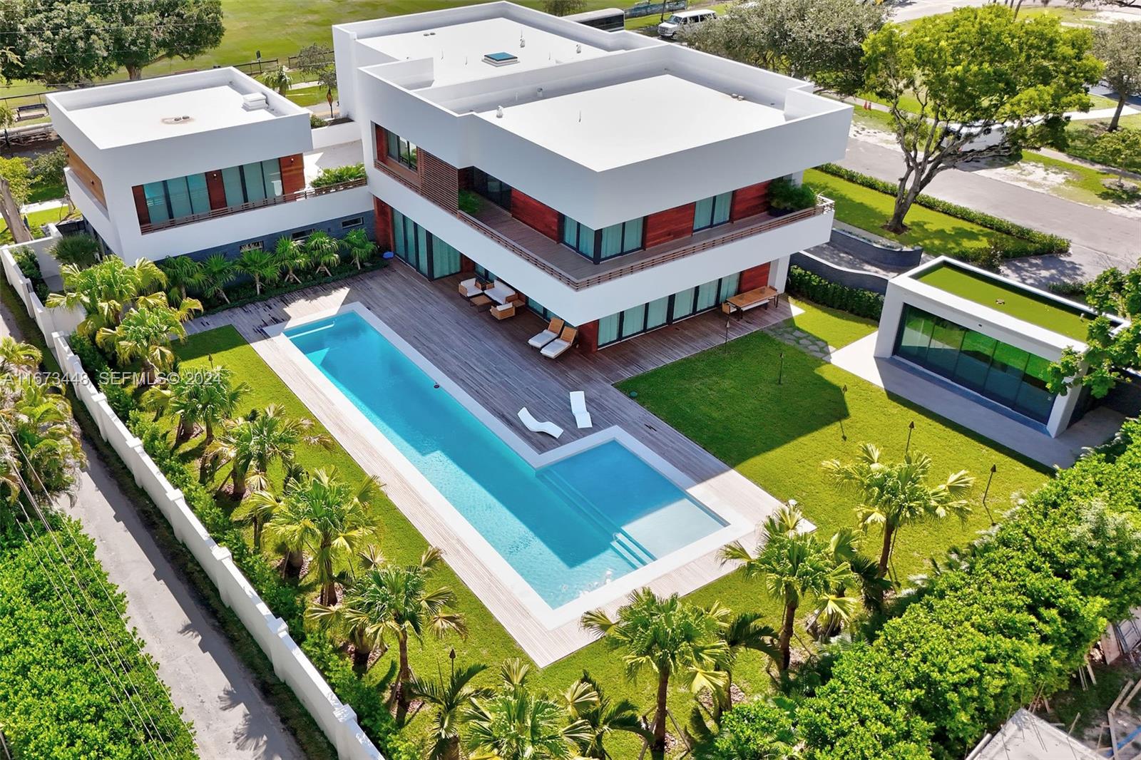 9860 Northeast 5th Avenue Road Miami Shores, FL 33138 - Photo 9 of 56 a aerial view of a house with swimming pool
