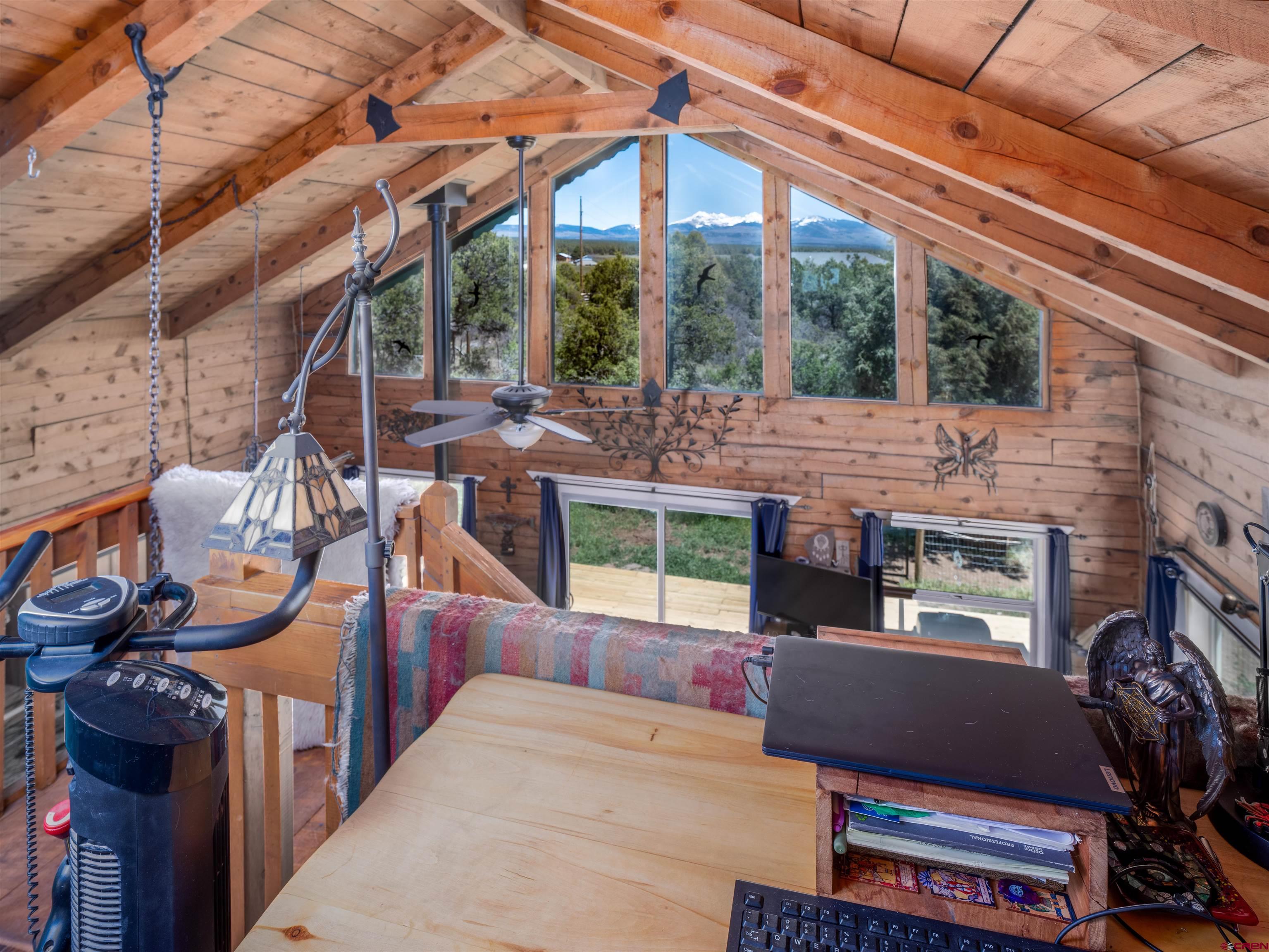 36859 Rd P.2 Mancos, CO 81328 - Photo 14 of 28 a roof deck with table and chairs a barbeque