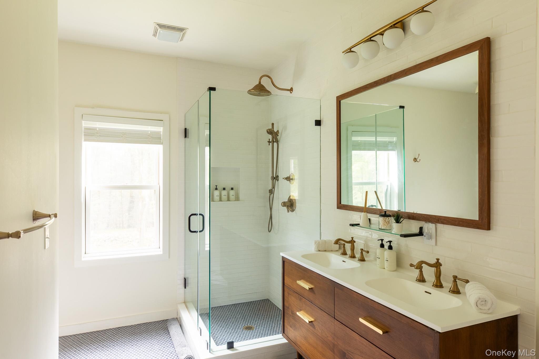 483 Acorn Hill Road Olivebridge, NY 12461 - Photo 25 of 50 Full bath with a shower stall, double vanity, and dark tile patterned floors