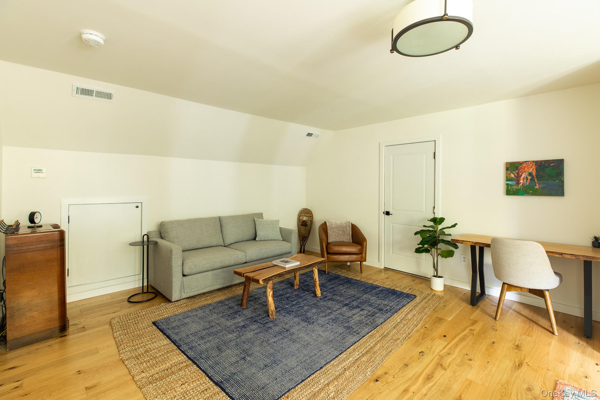483 Acorn Hill Road Olivebridge, NY 12461 - Photo 35 of 50 Living area featuring light wood-style floors and lofted ceiling