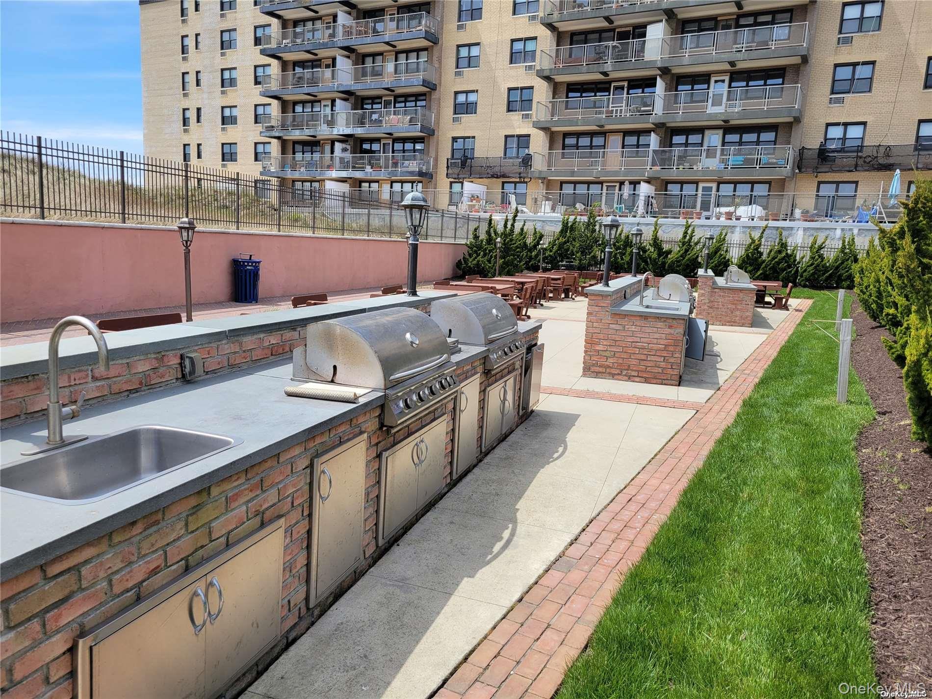 2 Richmond Road, Unit 6F Lido Beach, NY 11561 - Photo 14 of 14 View of patio / terrace with exterior kitchen and a sink