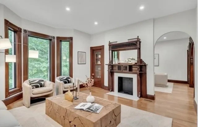 a living room with furniture fireplace and flat screen tv
