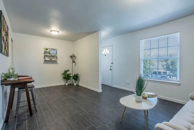 a view of a livingroom with furniture and wooden floor