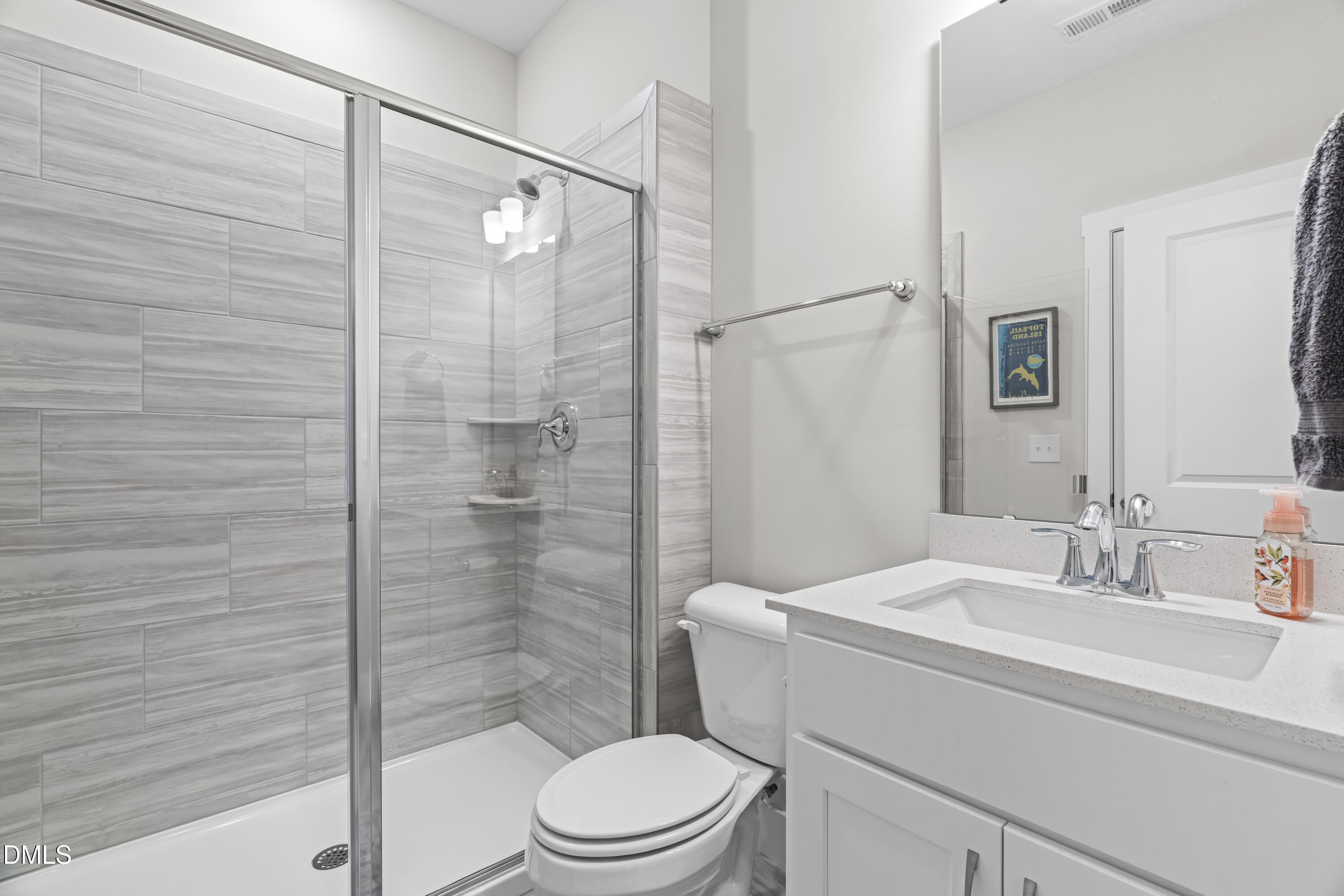 108 Bridge Street Smithfield, NC 27577 - Photo 14 of 48 a bathroom with a sink a toilet and shower