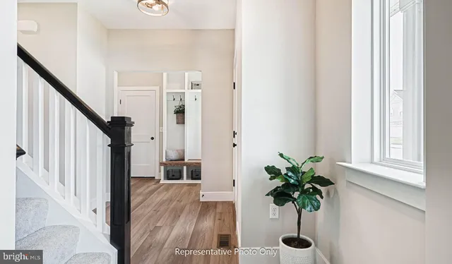 a view of entryway with wooden floor