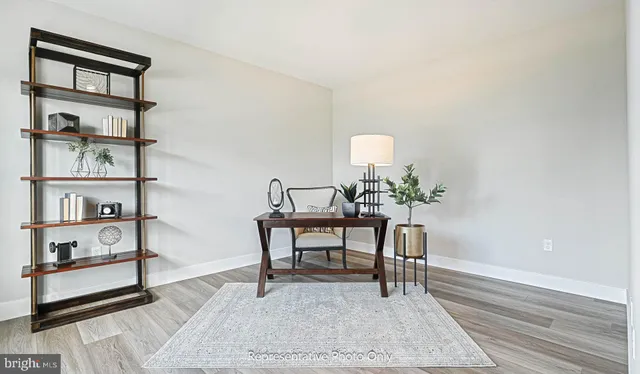 a kitchen with granite countertop a sink stove and cabinets