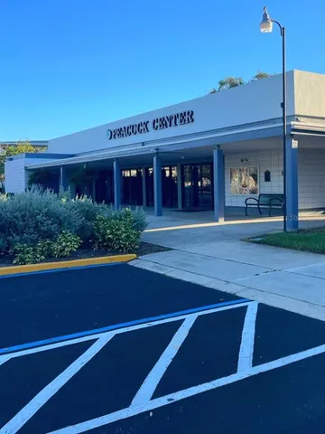 a view of a chairs and table in the balcony