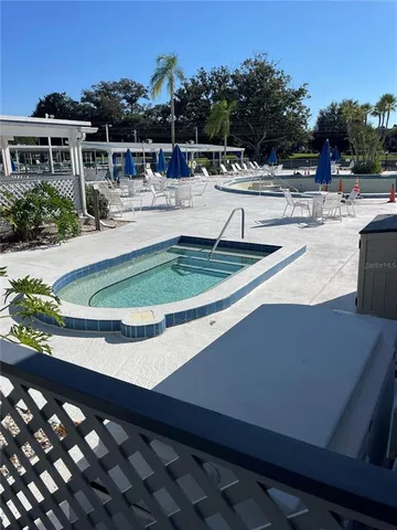 a view of a yard with chairs