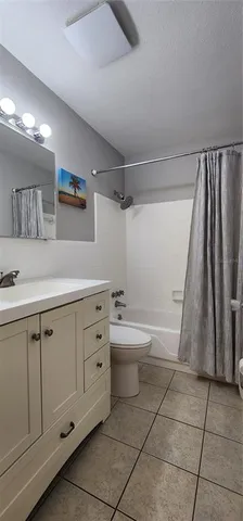 a bathroom with a sink a toilet and a bathtub