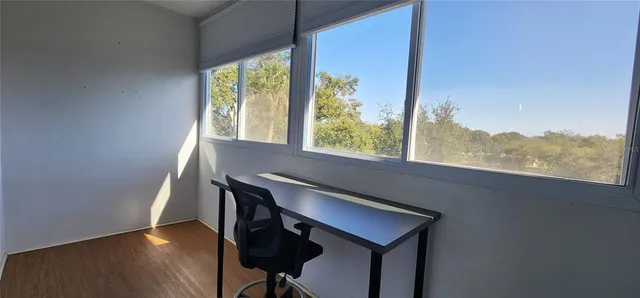 a view of a window with wooden floor